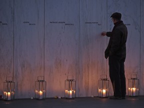 A man pays his respects at the Wall of Names at the United Flight 93 National Memorial in Shanksville, Pa., Saturday, Sept. 10, 2017. (AP Photo/Fred Vuich)