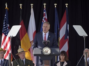Interior Secretary Ryan Zinke speaks during the service of remembrance tribute to the passengers and crew of United Flight 93 at the Flight 93 National Memorial in Shanksville, Pa., Monday, Sept. 11, 2017. (AP Photo/Fred Vuich)