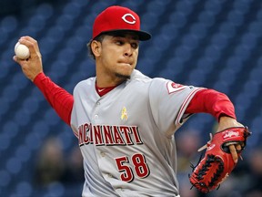 Cincinnati Reds starting pitcher Luis Castillo delivers in the first inning of a baseball game against the Pittsburgh Pirates in Pittsburgh, Friday, Sept. 1, 2017. (AP Photo/Gene J. Puskar)