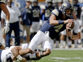 Rice defensive end Brian Womac (44) sacks Pittsburgh quarterback Max Browne (4) during the first quarter of an NCAA college football game, Saturday, Sept. 30, 2017, in Pittsburgh. (AP Photo/Keith Srakocic)