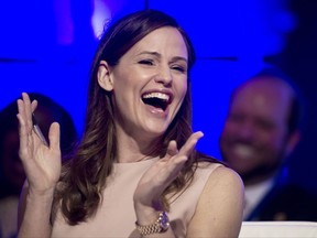 FILE - In this Feb. 25, 2017, file photo, actress Jennifer Garner reacts to a momentary malfunction of her microphone while addressing the National Governors Association Winter Meeting about early education, in Washington. Garner posted a video of herself on Instagram Sept. 14, 2017, in which she laughs and talks with slurred speech after a dental appointment while emotionally praising a song from the musical "Hamilton." (AP Photo/Cliff Owen, File)