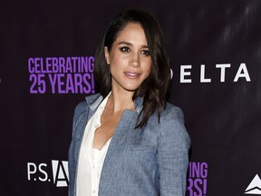 FILE - In this May 20, 2016. file photo, actress Meghan Markle poses at P.S. Arts' "the pARTy!" in Los Angeles. Markle told Vanity Fair for an interview published online on Sept. 5, 2017, that she and Prince Harry are "two people who are really happy and in love." (Photo by Chris Pizzello/Invision/AP, File)