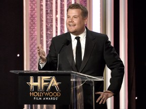 FILE - In this Nov. 6, 2016, file photo, host James Corden speaks at the 20th annual Hollywood Film Awards at the Beverly Hilton Hotel in Beverly Hills, Calif. Dick Clark Productions announced on Sept. 25, 2017, that Corden will return to host a third straight year when the awards are handed out on Nov. 5, 2017. (Photo by Chris Pizzello/Invision/AP, File)