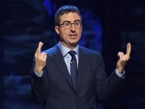 FILE - In this Feb. 28, 2015, file photo, John Oliver speaks in New York. Oliver, Jon Stewart, Trevor Noah and Conan O'Brien were announced Sept. 12, 2017, as headliners for the Nov. 7 Stand Up for Heroes fundraiser, which benefits injured veterans and their families.( Photo by Charles Sykes/Invision/AP, File)