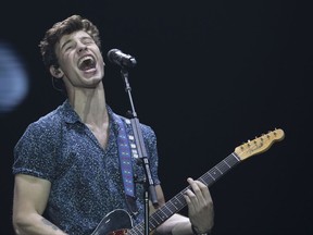 FILE - In this Sept. 16, 2017, file photo, Canadian singer Shawn Mendes performs at the Rock in Rio music festival in Rio de Janeiro, Brazil. Mendes announced on Sept. 22, 2017, that he was launching an online fundraiser to help those affected by the Sept. 19 earthquake in Mexico. (AP Photo/Leo Correa, File)