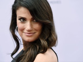 FILE - In this Thursday, June 9, 2016, file photo, singer Idina Menzel looks over her shoulder at photographers at the 2016 AFI Life Achievement Award Gala Tribute to John Williams at the Dolby Theatre in Los Angeles. Menzel announced her marriage to actor Aaron Lohr on Sept. 25, 2017. (Photo by Chris Pizzello/Invision/AP, File)