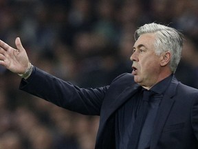 Bayern coach Carlo Ancelotti gives directions to his players during a Champions League Group B soccer match between Paris Saint-Germain and Bayern Munich at the Parc des Princes stadium in Paris, France, Wednesday, Sept. 27, 2017. (AP Photo/Christophe Ena)