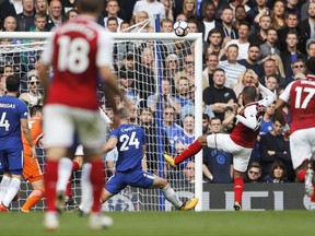 Arsenal's Alexandre Lacazette, second right, misses a chance to score during the English Premier League soccer match between Chelsea and Arsenal at Stamford Bridge stadium in London, Sunday, Sept. 17, 2017. (AP Photo/Frank Augstein)