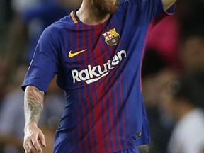 Barcelona's Lionel Messi celebrates after scoring his side's third goal during a Champions League group D soccer match between FC Barcelona and Juventus at the Camp Nou stadium in Barcelona, Spain, Tuesday, Sept. 12, 2017. (AP Photo/Francisco Seco)