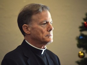 FILE--In this Dec. 20, 2016, file photo, Santa Fe Archbishop John C. Wester speaks at the Archdiocese of Santa Fe in Albuquerque, N.M. Wester announced Tuesday, Sept. 12, 2017, he was releasing the names of priests and religious leaders who have been found guilty of sexually abusing children after decades of pressure from victims and their family members. (AP Photo/Russell Contreras, file)