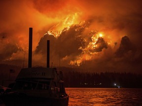 This Monday Sept. 4, 2017, photo provided by KATU-TV shows the Eagle Creek wildfire as seen from Stevenson Wash., across the Columbia River, burning in the Columbia River Gorge above Cascade Locks, Ore. A lengthy stretch of highway Interstate 84 remains closed Tuesday, Sept. 5, as crews battle the wildfire that has also caused evacuations and sparked blazes across the Columbia River in Washington state. (Tristan Fortsch/KATU-TV via AP)