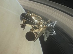 This illustration shows NASA's Cassini spacecraft about to make one of its dives between Saturn and its innermost rings as part of the mission's grand finale.