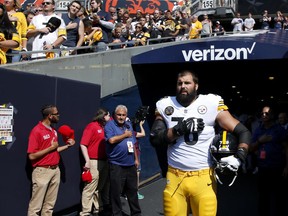 Pittsburgh Steelers lineman Alejandro Villanueva stands alone during the national anthem in Chicago on Sept. 24.