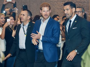 England's Prince Harry leaves Toronto's Scotiabank Plaza after taking part in the True Patriot Love Foundations Symposium prior to the start of the Invictus Games, Friday September 22, 2017.