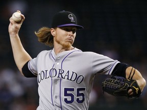 Colorado Rockies' Jon Gray throws a pitch against the Arizona Diamondbacks during the first inning of a baseball game Tuesday, Sept. 12, 2017, in Phoenix. (AP Photo/Ross D. Franklin)