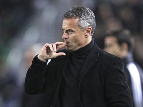 FILE - In this Feb. 22, 2015 file photo, soccer coach Fran Escriba touches his face during a Spanish La Liga soccer match in Elche, Spain. Villarreal has fired coach Fran Escriba on Monday Sept. 25, 2017 after the team's disappointing start in the Spanish league. Villarreal says a new coach would be announced shortly. (AP Photo/Alberto Saiz, File)