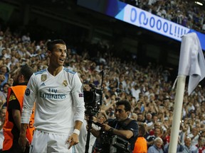 Real Madrid's Cristiano Ronaldo reacts after scoring the first goal during a Champions League group H soccer match between Real Madrid and Apoel Nicosia at the Santiago Bernabeu stadium in Madrid, Spain, Wednesday, Sept. 13, 2017. (AP Photo/Paul White)