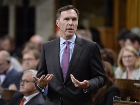 Finance Minister Bill Morneau rises during question period in the House of Commons on Parliament Hill in Ottawa on Thursday, Sept.28, 2017.