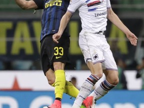 FILE - In this April 3, 2017 file photo, Inter Milan's Danilo D'Ambrosio , left, and Sampdoria's Patrik Schick jump for the ball during a Serie A soccer match between Inter Milan and Sampdoria, at the San Siro stadium in Milan, Italy. It has been a rapid rise for new Roma player Patrik Schick, who has gone from playing for a mid-level Czech team to a title-chasing Serie A side in just over a year.  (AP Photo/Antonio Calanni, file)