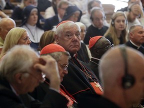 Cardinal Gerhard Ludwig Mueller, center, attends a conference on the Latin Mass at the Pontifical University of St. Thomas Aquinas in Rome, Thursday, Sept. 14, 2017. (AP Photo/Gregorio Borgia)