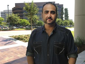 U.S. Navy veteran Mohammed Jahanfar poses for a photo during an interview on Wednesday, Sept. 27, 2017, in Long Beach, Calif. Jahanfar, is seeking a visa to bring his Iranian fiancée to live with him in California, and fears that may not be possible due to the Trump administration's latest travel restrictions for Iran. (AP Photo/Amy Taxin)