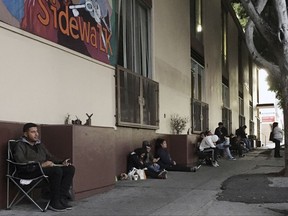 This Thursday, Sept. 28, 2017 Ivan Vizueta, waits in line at CHIRLA (Coalition for Humane Immigrant Rights Los Angeles) to renew his work permit under an expiring Obama-era program for immigrants brought to the country as children. After Oct. 5, 2017, no one else can renew under the program that has let nearly 800,000 immigrants brought to the United States as children work in the country even though they lack legal papers. (AP Photo/Amy Taxin)