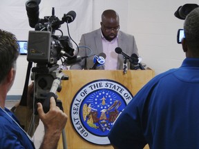 FILE - In this Monday, April 24, 2017, file photo, Solomon Graves, a spokesman for the Arkansas Department of Correction, speaks to reporters at the Cummins Unit prison in Varner, Ark. Pulaski County Circuit Judge Mackie Pierce said Tuesday, Sept. 19, 2017, that prison officials must release the package label from a recently acquired lethal injection drug. He rejected the state's argument that privacy granted to drug sellers and suppliers in Arkansas' execution law also extends to manufacturers. (AP Photo/Kelly P. Kissel File)