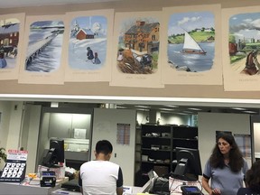 In this Tuesday, Aug. 29, 2017 photo, a mural hangs in the Durham, N.H., post office. The mural includes a panel in another area showing an image of a Native American and inscribed with the words "Cruel Adversity." Critics have called the image demeaning to Native Americans and demanded it be removed. The town has called for the post office to include language into the mural that puts the image into context. (AP Photo/Michael Casey).
