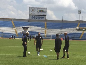 U.S. soccer goalkeepers Tim Howard, left, Nick Rimando, second from right, Brad Guzman, right, and goalkeeper coach Matt Reis, second from left, practice at Estadio Olimpico Metropolitano in San Pedro Sula, Honduras Mpnday, Sept. 4, 2017. After another stunning home loss, the United States has left itself little margin for error in its last three World Cup qualifiers, starting with Tuesday afternoon's match in the tropical heat and humidity of Honduras. (AP Photo/Ron Blum)