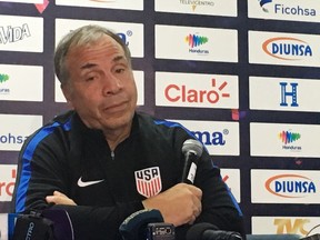 U.S. coach Bruce Arena speaks at a news conference at Estadio Olimpico Metropolitano in San Pedro Sula, Honduras, Monday, Sept. 4, 2017, ahead of a World Cup qualifier Tuesday. Arena thinks the divisive debate over immigration policy in the United States is firing up opposing players and fans. (AP Photo/Ron Blum)