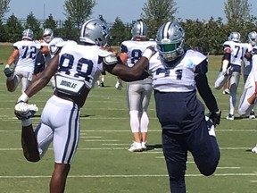 Dallas Cowboys' Ezekiel Elliott, right, stretches with Dez Bryant (88) at practice in Frisco, Texas, Wednesday, Sept. 6, 2017. An arbitrator denied Elliott's appeal of a six-game suspension in a domestic violence case Tuesday, but the 2016 NFL rushing champion will play in the opener because of the timing of the decision. (AP Photo/Schuyler Dixon)