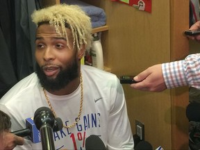 New York Giants wide receiver Odell Beckham Jr. speaks with reporters in the locker room at  NFL football team's training facility, Thursday, Sept. 14, 2017, in East Rutherford, N.J. Beckham, who has not practiced since spraining his ankle in a preseason game on Aug. 21, took the next step in his recovery from a sprained left ankle by participating in the individual segment of practice. (AP Photo/Tom Canavan)