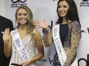 CORRECTS NAME TO MARGANA, NOT MORGANA - Miss Texas Margana Wood, left, and Miss Utah JessiKate Riley, right, meet the media after winning the first night of preliminary competition in the Miss America competition on Wednesday, Sept. 6, 2017, in Atlantic City N.J. Wood won the swimsuit competition, while Riley won the talent portion playing a 115-year-old violin from Austria. (AP Photo/Wayne Parry)