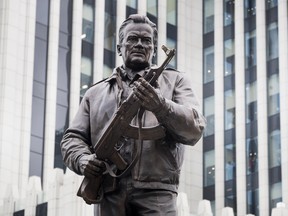 A new monument to Russian firearm designer Mikhail Kalashnikov is unveiled during an official ceremony in Moscow, Russia, Tuesday, Sept. 19, 2017. Kalashnikov, who died in 2013 at age 94 in the city of Izhevsk, has received accolades as the creator of the AK-47 assault rifle.