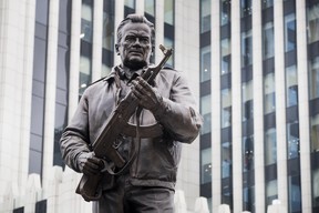 A new monument to Russian firearm designer Mikhail Kalashnikov is unveiled during an official ceremony in Moscow, Russia, Tuesday, Sept. 19, 2017. Kalashnikov, who died in 2013 at age 94 in the city of Izhevsk, has received accolades as the creator of the AK-47 assault rifle.