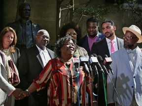 FILE - In this May 2,  2017 file photo, Judy Scott, mother of Walter Scott, who was killed by former Police Officer Michael Slager in 2015, speaks after the plea hearing held for Slager, in Charleston, S.C. Slager, whose killing of Scott running from a traffic stop pleaded guilty to federal civil rights charges. Changes to a Department of Justice program that had reviewed police departments in hopes of building community trust have dismayed some civil rights advocates and left some cities wondering what to do next. (Leroy Burnell/The Post And Courier via AP File)