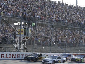 Kevin Harvick (4) leads the field past the green flag at the start of a NASCAR Monster Cup auto race at Darlington Raceway, Sunday, Sept. 3, 2017, in Darlington, S.C. (AP Photo/Terry Renna)