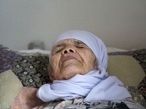106-year old Afghan refugee Bibihal Uzbeki lies in bed in Hova, Sweden, Sunday, Sept. 3, 2017
