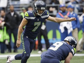 Seattle Seahawks Blair Walsh (7) kicks his second field goal of the first half of an NFL football game against the San Francisco 49ers as Jon Ryan (9) holds, Sunday, Sept. 17, 2017, in Seattle. (AP Photo/Elaine Thompson)