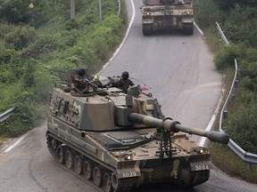 South Korean army's K-9 self-propelled howitzers move during a military exercise in Paju, South Korea, near the border with North Korea, Wednesday, Sept. 6, 2017. South Korean President Moon Jae-in said ahead of a meeting with Russian President Vladimir Putin that he hopes their two countries can work together to resolve the North Korean nuclear issue. (AP Photo/Ahn Young-joon)