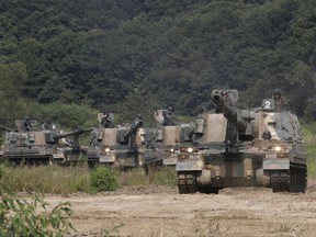 South Korean army's K-9 self-propelled howitzers move during a military exercise in Paju, South Korea, near the border with North Korea, Monday, Sept. 4, 2017. Following U.S. warnings to North Korea of a "massive military response," South Korea's military on Monday fired missiles into the sea to simulate an attack on the North's main nuclear test site a day after Pyongyang detonated its largest ever nuclear test explosion. (AP Photo/Ahn Young-joon)