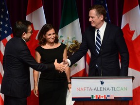 Mexico's Secretary of Economy Ildefonso Guajardo Villarreal (left) shakes hands with United States Trade Representative Robert Lighthizer as Canada's Foreign Affairs Minister Chrystia Freeland looks on at a news conference on the NAFTA negotiations in Ottawa on Wednesday, Sept. 27, 2017. THE CANADIAN PRESS/Sean Kilpatrick