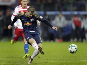Leipzig's Timo Werner scores his side's 2nd goal during the German Bundesliga soccer match between Hamburger SV and RB Leipzig in Hamburg, Germany, Friday, Sept. 8, 2017. (AP Photo/Michael Sohn)