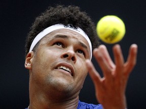 Wilfried Tsonga of France serves the ball to Dusan Lajovic of Serbia during their Davis Cup semi final at the Pierre Mauroy stadium in Lille, northern France, Sunday, Sept.17, 2017. (AP Photo/Michel Spingler)