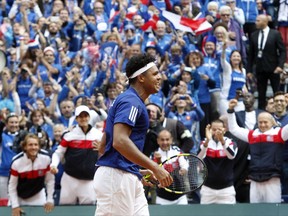 Wilfried Tsonga of France jubilates after winning the Davis Cup semi final against Serbia at the Pierre Mauroy stadium in Lille, northern France, Sunday, Sept.17, 2017. (AP Photo/Michel Spingler)