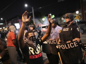 Demonstrators confront police while protesting the acquittal of former St. Louis police officer Jason Stockley on September 16, 2017 in St. Louis, Missouri. Dozens of business windows were smashed and at least two police cars were damaged during a second day of protests following the acquittal of Stockley, who was been charged with first-degree murder last year following the 2011 on-duty shooting of Anthony Lamar Smith.