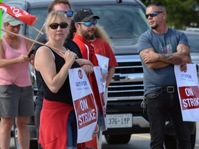 CAMI employees picket at the Ingersoll Automotive Assembly Plant on day one of a strike by workers against GM Canada.