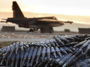 FILE - In this Dec. 18, 2015 file photo, provided by the Russian Defense Ministry Press Service, a load of ammunition is prepared to be loaded on Russian war planes at Hemeimeem Air Base, in Syria. Russia's military said Tuesday, Sept. 12, 2017, that Syrian troops have liberated about 85 percent of the war-torn country's territory from militants. Russia has been providing air cover for President Bashar Assad's troops since 2015, changing the tide of the war and giving Syrian and allied troops an advantage over opposition fighters and Islamic State group militants. (Vadim Savitsky/Russian Defense Ministry Press Service via AP, File)