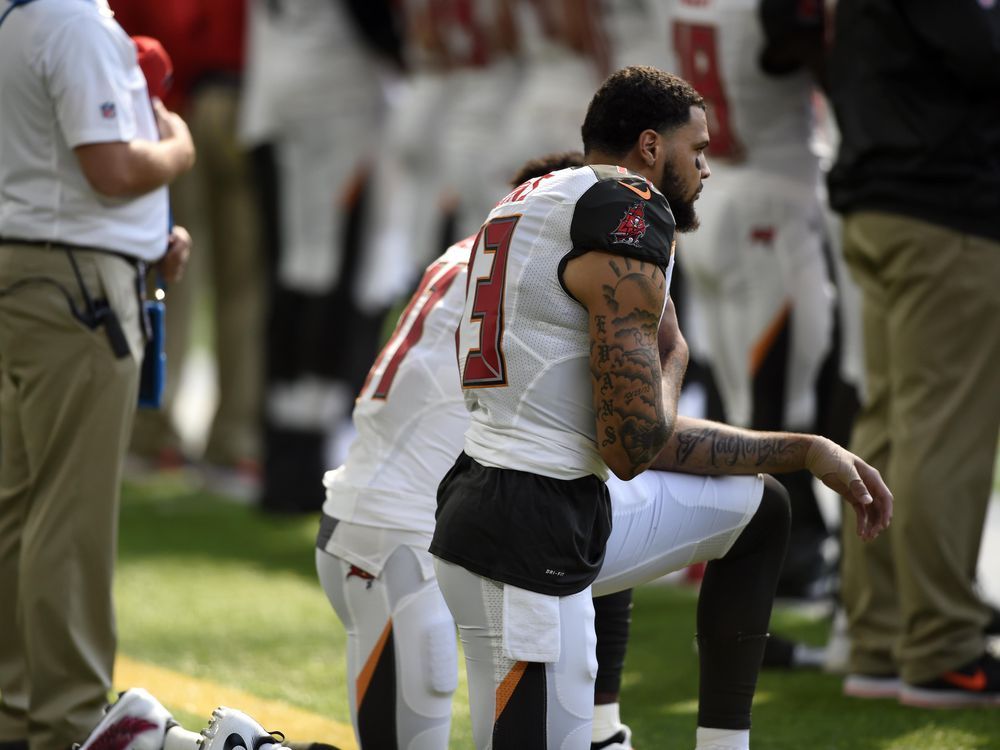 Mike Evans: NFL star sits during anthem in Donald Trump protest