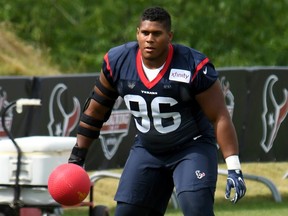 Eli Ankou performs a drill at Houston Texans training camp in White Sulphur Springs, W. Va., on July 26.